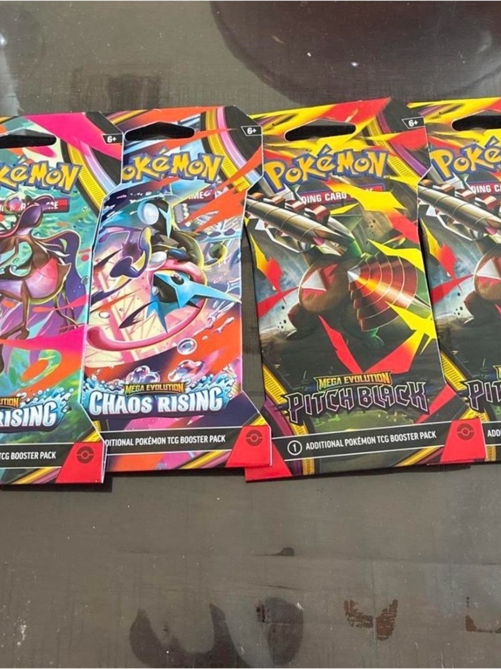TCG Booster Packs - Chaos Rising & Pitch Black (Assorted Colors)